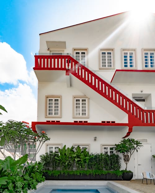 8M Wanderlust boutique hotel red stairs exterior