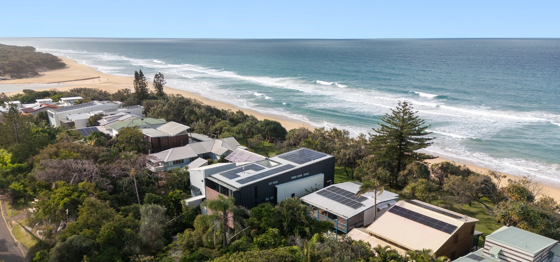 Watson St house: A designer beachfront residence with the ocean on one side and mountain views on the other, in Currimundi, Sunshine Coast